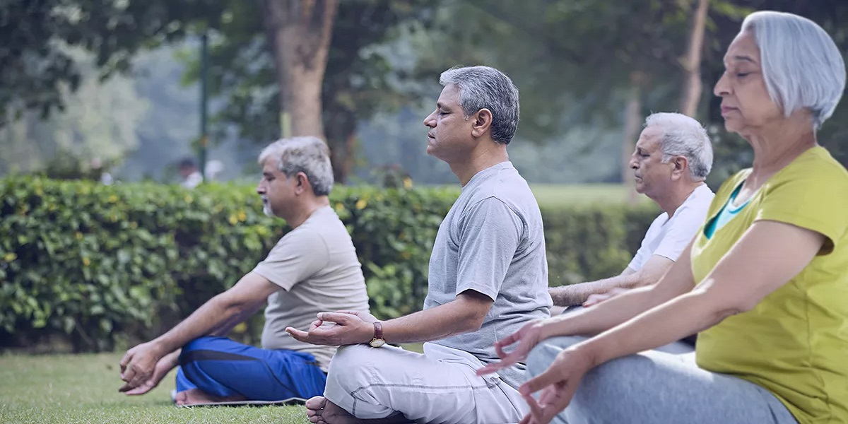 A Group of Aged Individuals Meditating at Atman Care Home